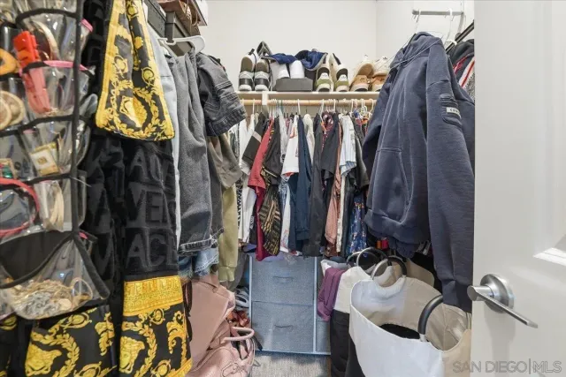a bathroom with a double vanity sink mirror and shower
