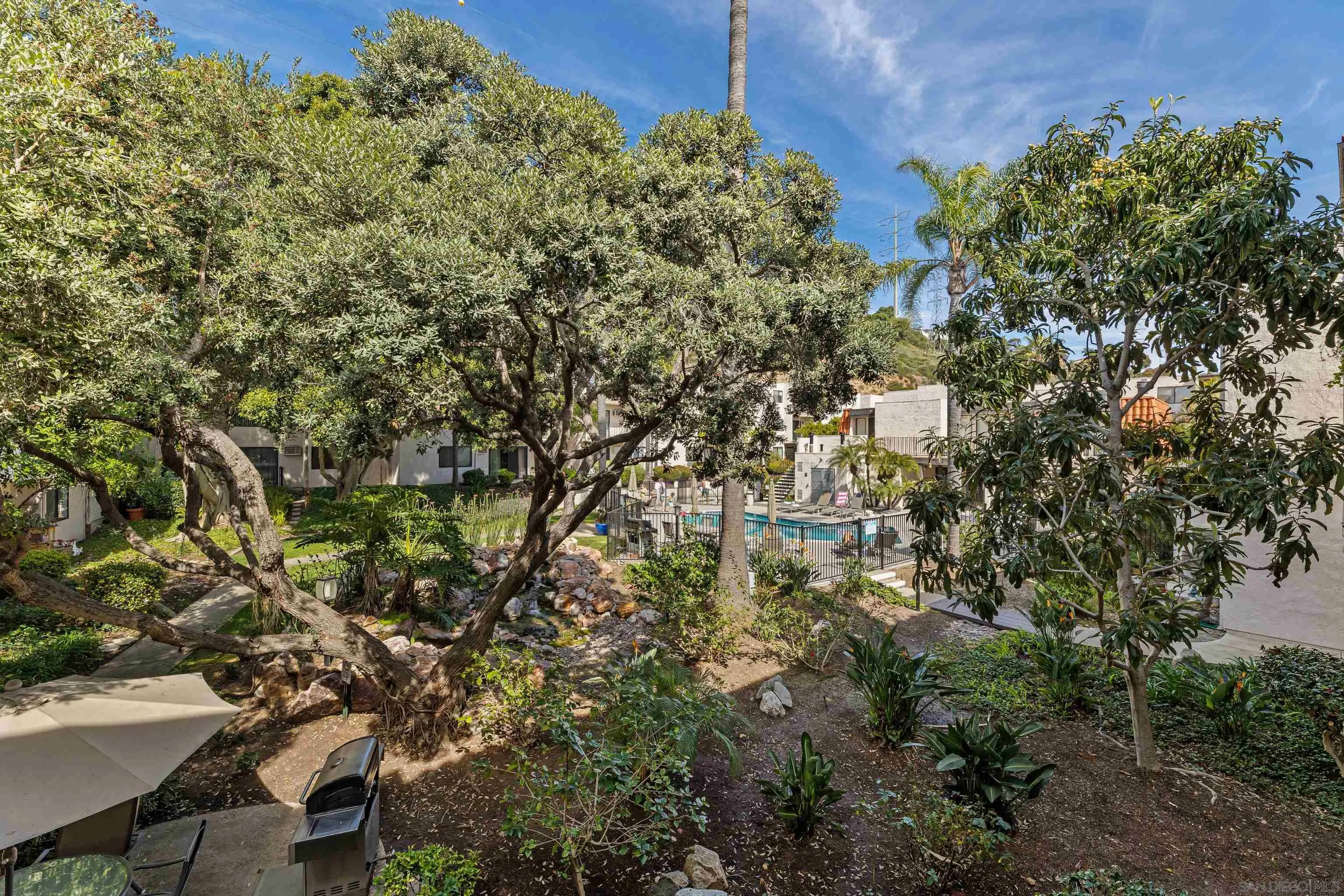6780 Friars Road, Unit 212 San Diego, CA 92108 - Photo 16 of 25 a view of a house with a tree