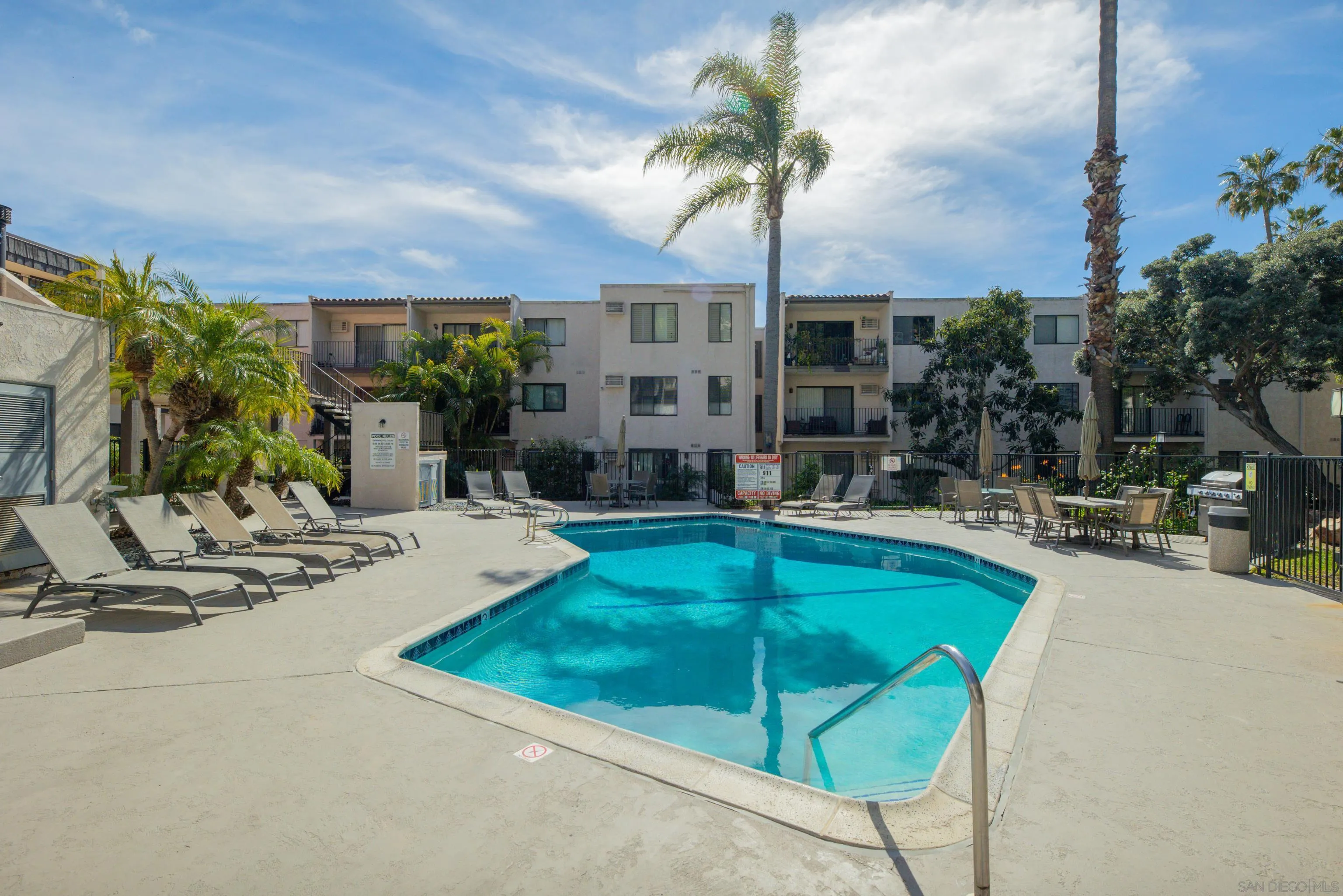 6780 Friars Road, Unit 212 San Diego, CA 92108 - Photo 17 of 25 a swimming pool with outdoor seating and yard