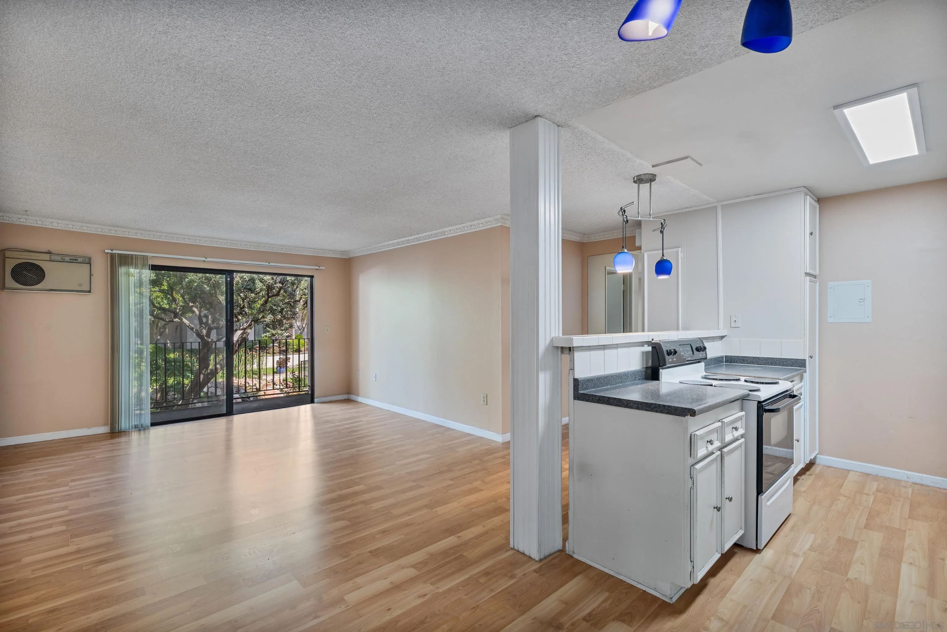 6780 Friars Road, Unit 212 San Diego, CA 92108 - Photo 4 of 25 a kitchen with granite countertop a sink and a stove