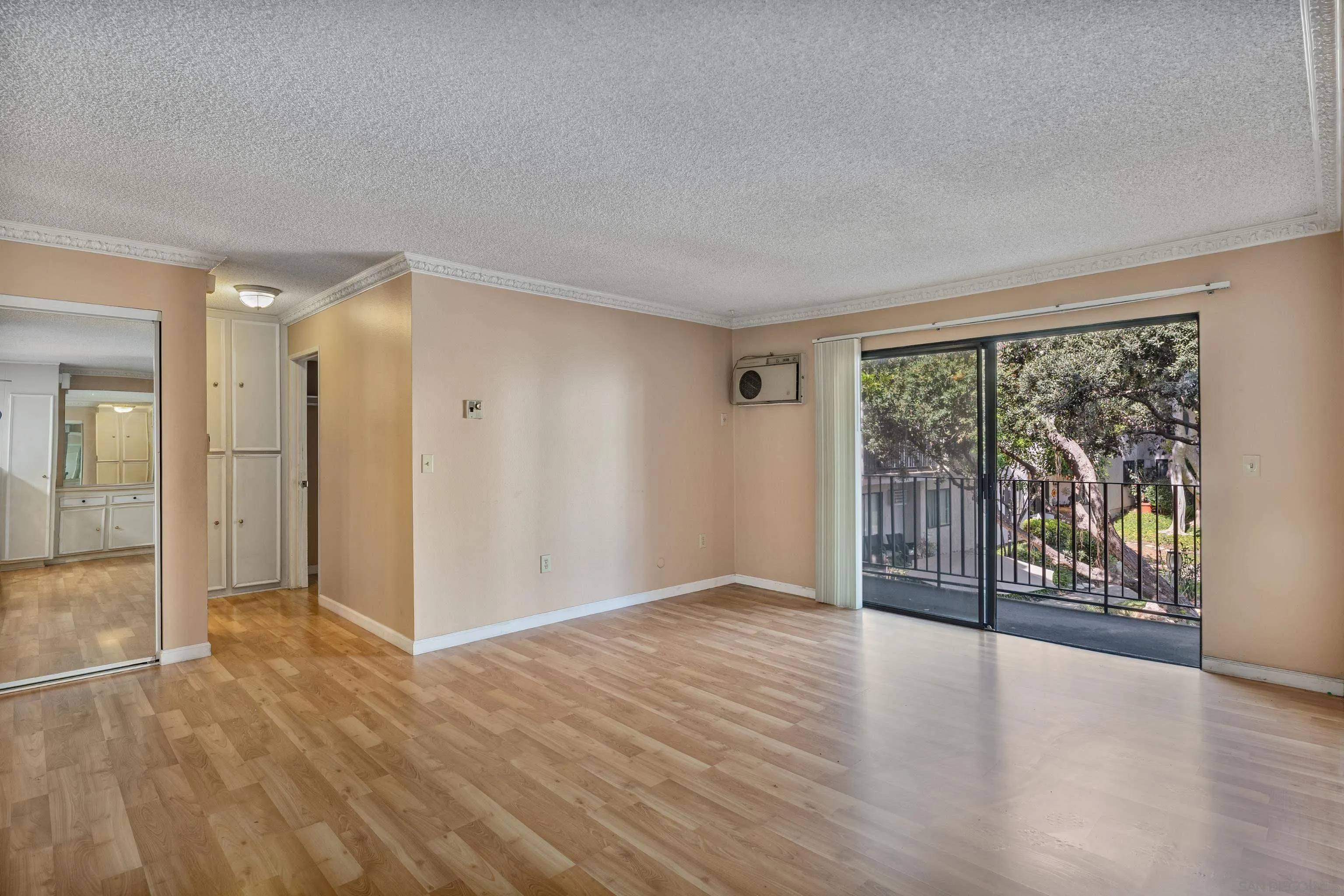 6780 Friars Road, Unit 212 San Diego, CA 92108 - Photo 5 of 25 wooden floor in an empty room with a window