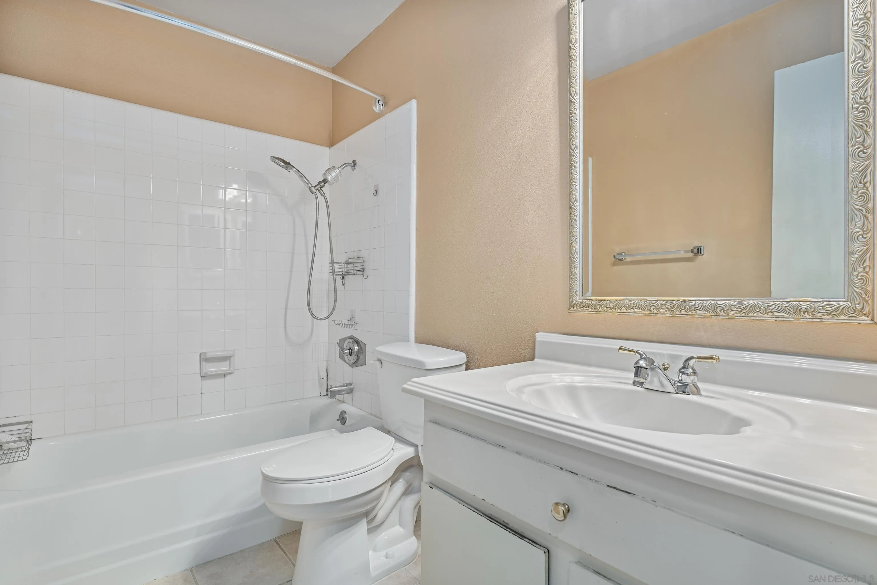 6780 Friars Road, Unit 212 San Diego, CA 92108 - Photo 7 of 25 a bathroom with a sink a toilet and shower