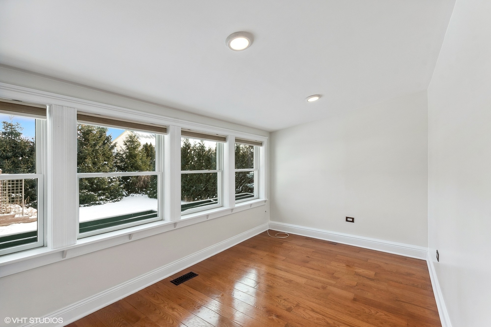 207 North Happ Road Northfield, IL 60093 - Photo 11 of 31 an empty room with wooden floor and windows
