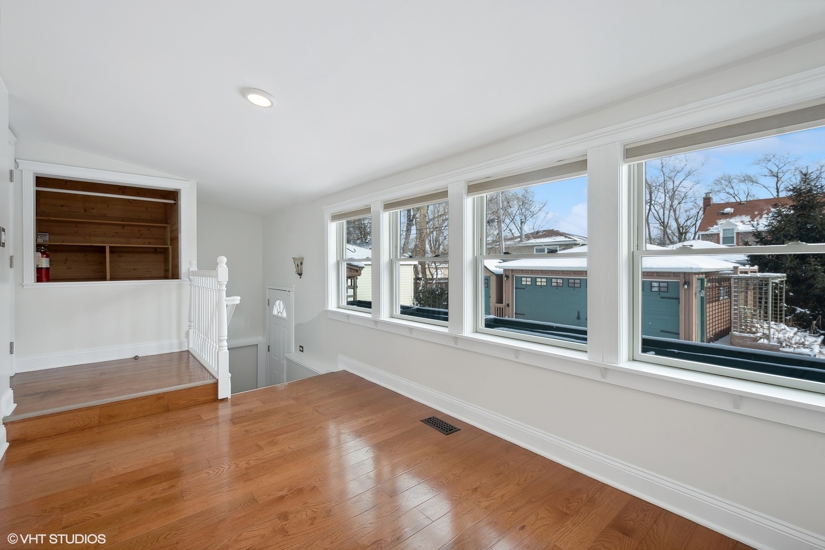 207 North Happ Road Northfield, IL 60093 - Photo 12 of 31 a view of an empty room with a window and kitchen view