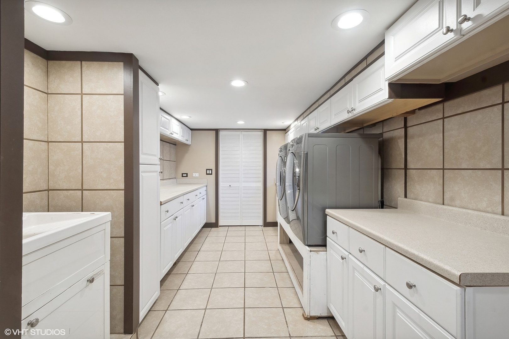 207 North Happ Road Northfield, IL 60093 - Photo 19 of 31 a kitchen with white cabinets and refrigerator