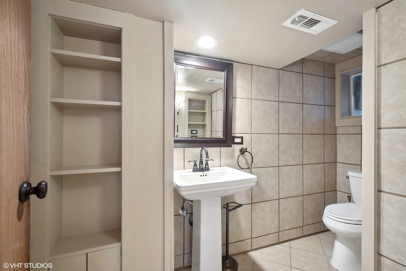207 North Happ Road Northfield, IL 60093 - Photo 26 of 31 a bathroom with a sink toilet and mirror