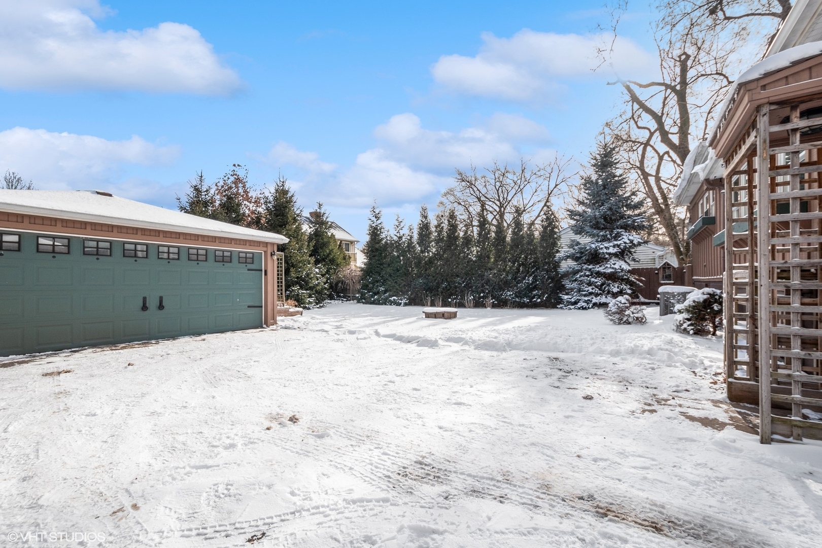 207 North Happ Road Northfield, IL 60093 - Photo 27 of 31 a view of garage and wooden fence