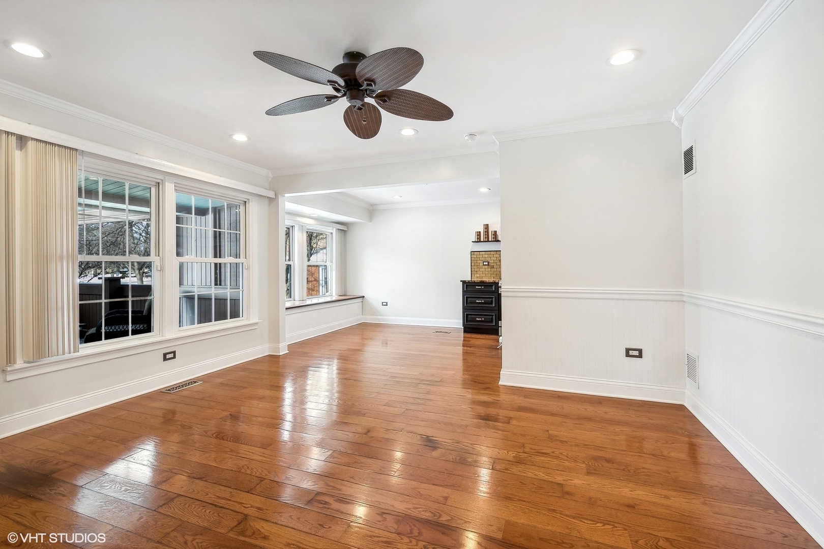 207 North Happ Road Northfield, IL 60093 - Photo 4 of 31 a view of an empty room with wooden floor and a window