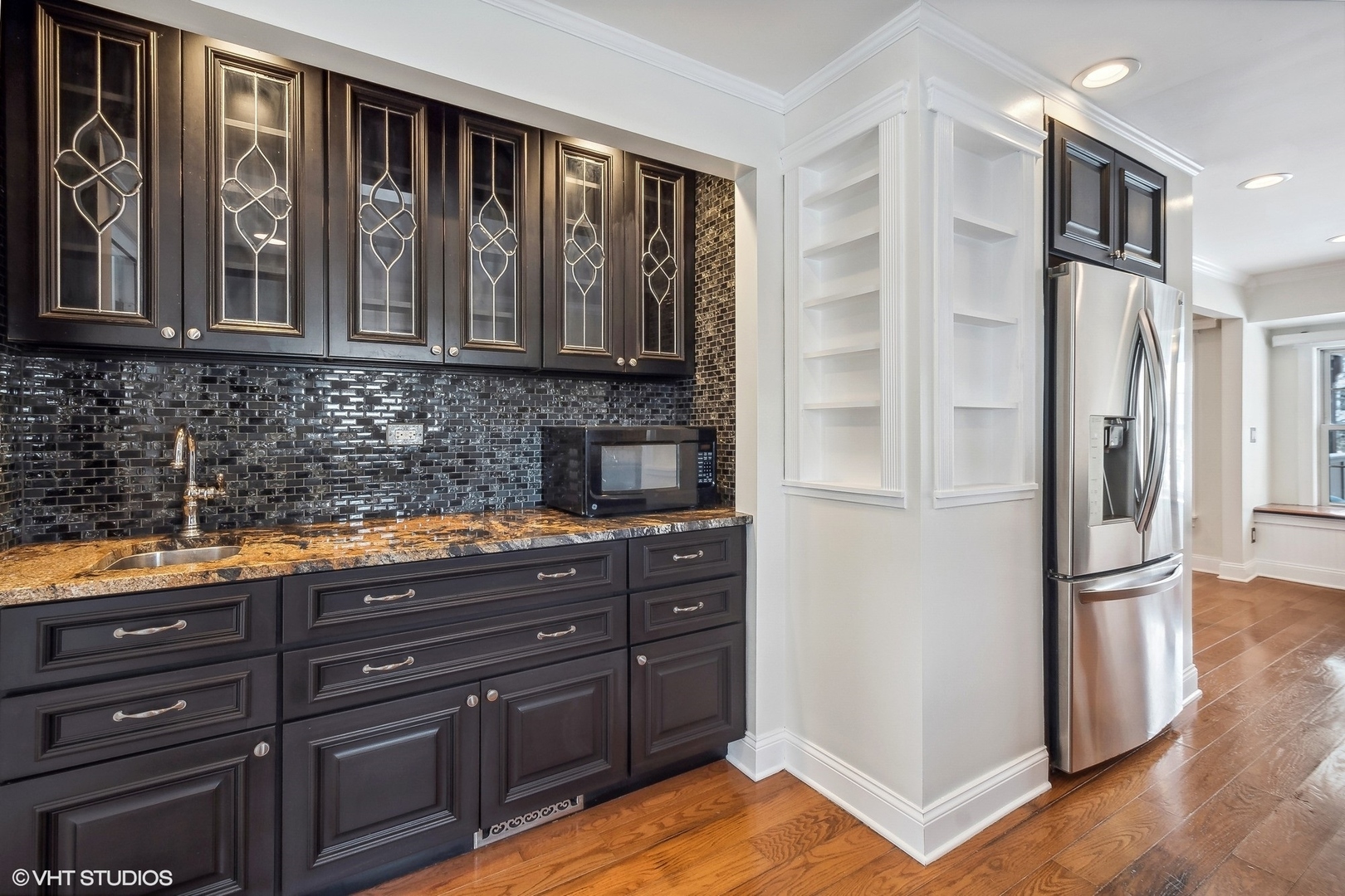 207 North Happ Road Northfield, IL 60093 - Photo 8 of 31 a kitchen with stainless steel appliances granite countertop a refrigerator and a sink