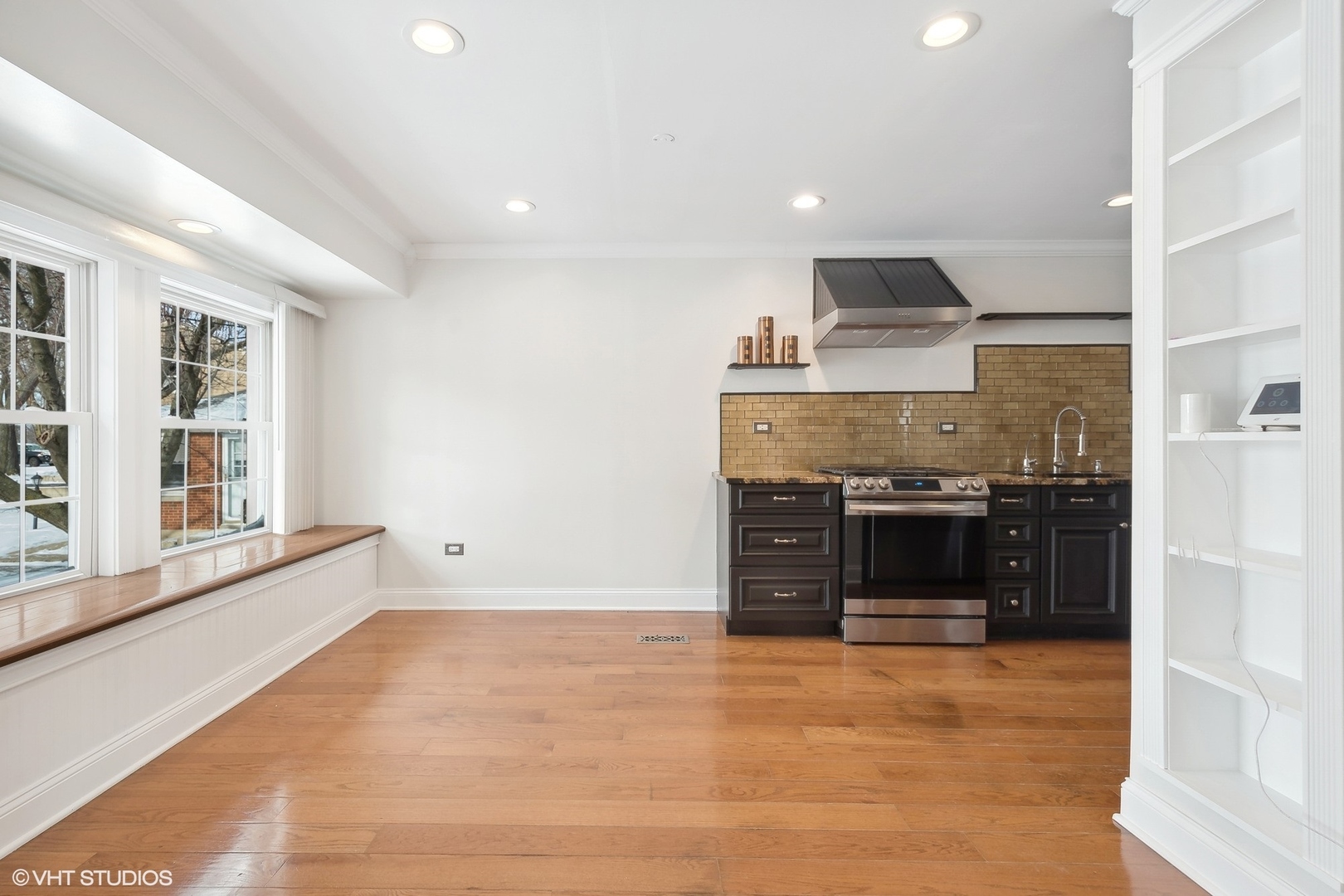 207 North Happ Road Northfield, IL 60093 - Photo 10 of 31 a kitchen with stainless steel appliances a stove and a refrigerator