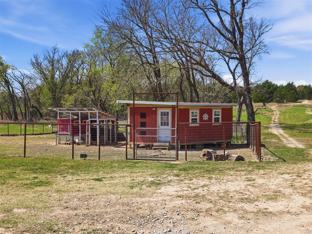 3823 State Highway Bonham, TX 75418 - Photo 33 of 37 a view of a house with backyard and trees