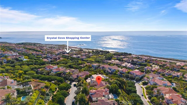 an aerial view of residential building and ocean