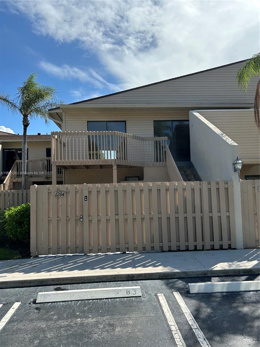 600 Executive Center Drive, Unit 204 West Palm Beach, FL 33401 - Photo 1 of 9 a backyard of a house