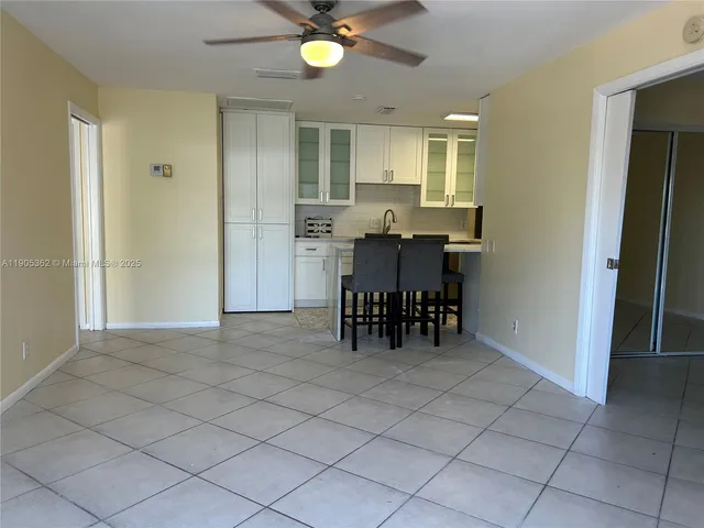 a view of dining room with furniture and chandelier