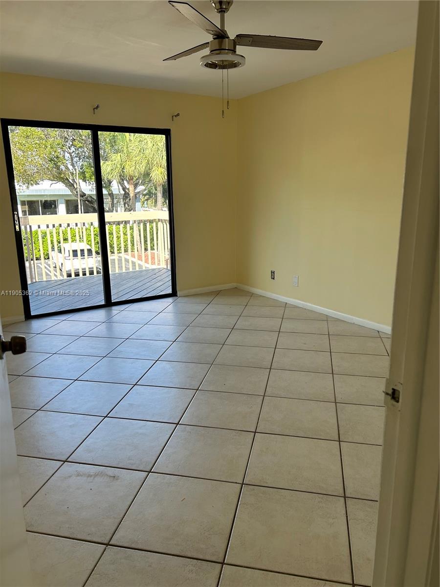 600 Executive Center Drive, Unit 204 West Palm Beach, FL 33401 - Photo 6 of 9 a view of empty room with windows