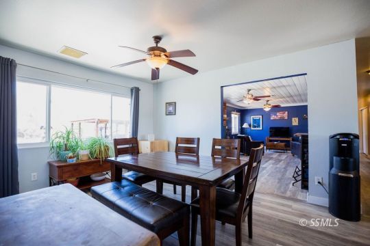 2030 South Inyo Street Ridgecrest, CA 93555 - Photo 14 of 42 a view of a dining room with furniture window and wooden floor