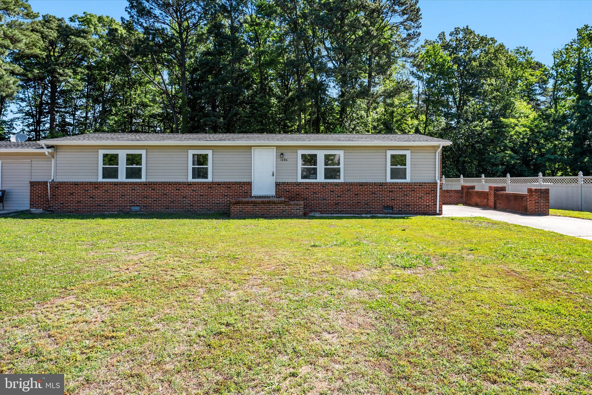 108 Wilson Road Grasonville, MD 21658 - Photo 2 of 38 a view of a house with big yard and large trees