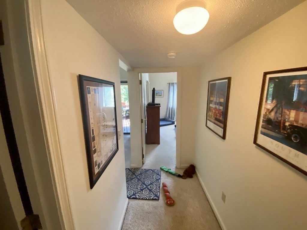 215 Trailside Way, Unit 215 Ashland, MA 01721 - Photo 12 of 15 a view of a hallway with front door