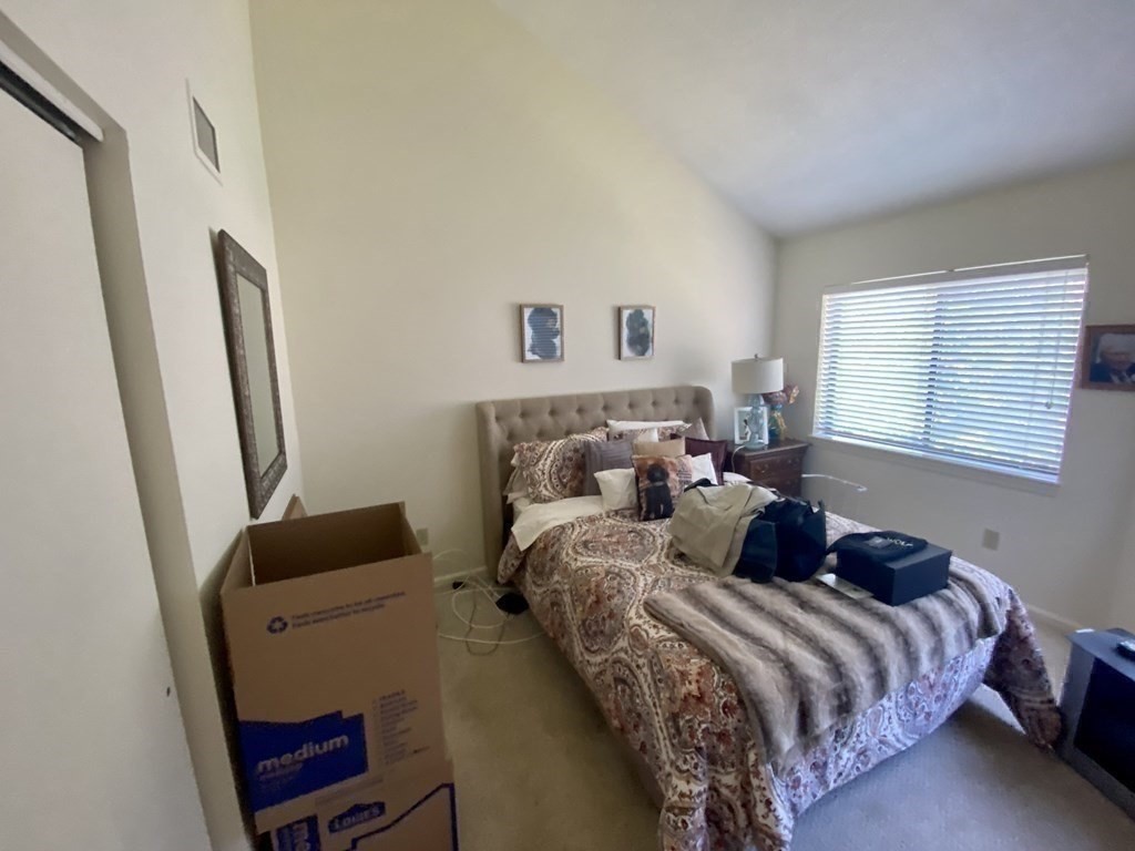 215 Trailside Way, Unit 215 Ashland, MA 01721 - Photo 13 of 15 a bedroom with bed and a window