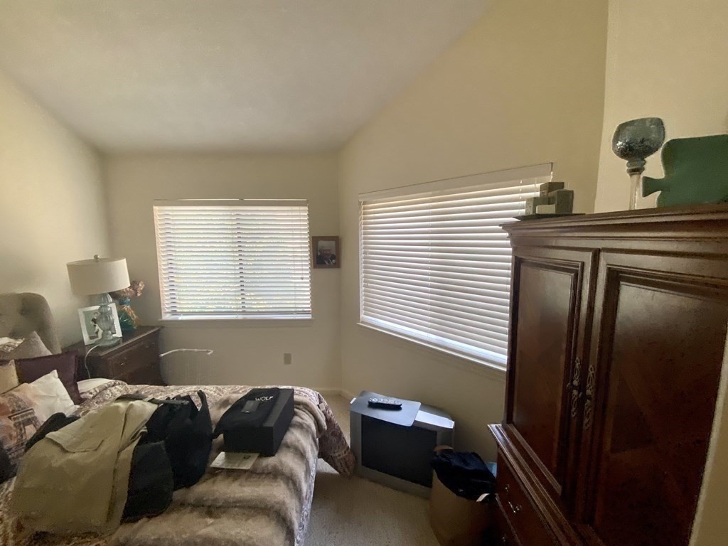 215 Trailside Way, Unit 215 Ashland, MA 01721 - Photo 14 of 15 a living room with a couch and a window