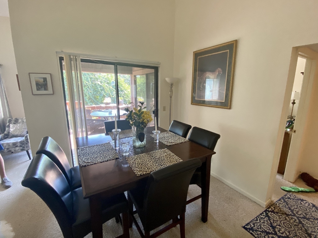 215 Trailside Way, Unit 215 Ashland, MA 01721 - Photo 8 of 15 a dining room with furniture and window