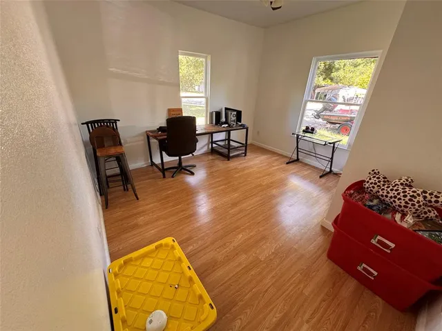 a view of a workspace with furniture