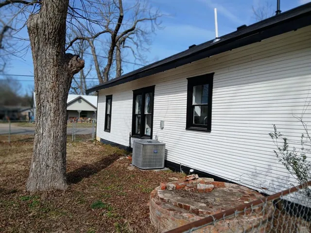 a backyard of a house with seating space