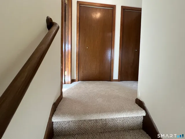 a view of hallway with large windows