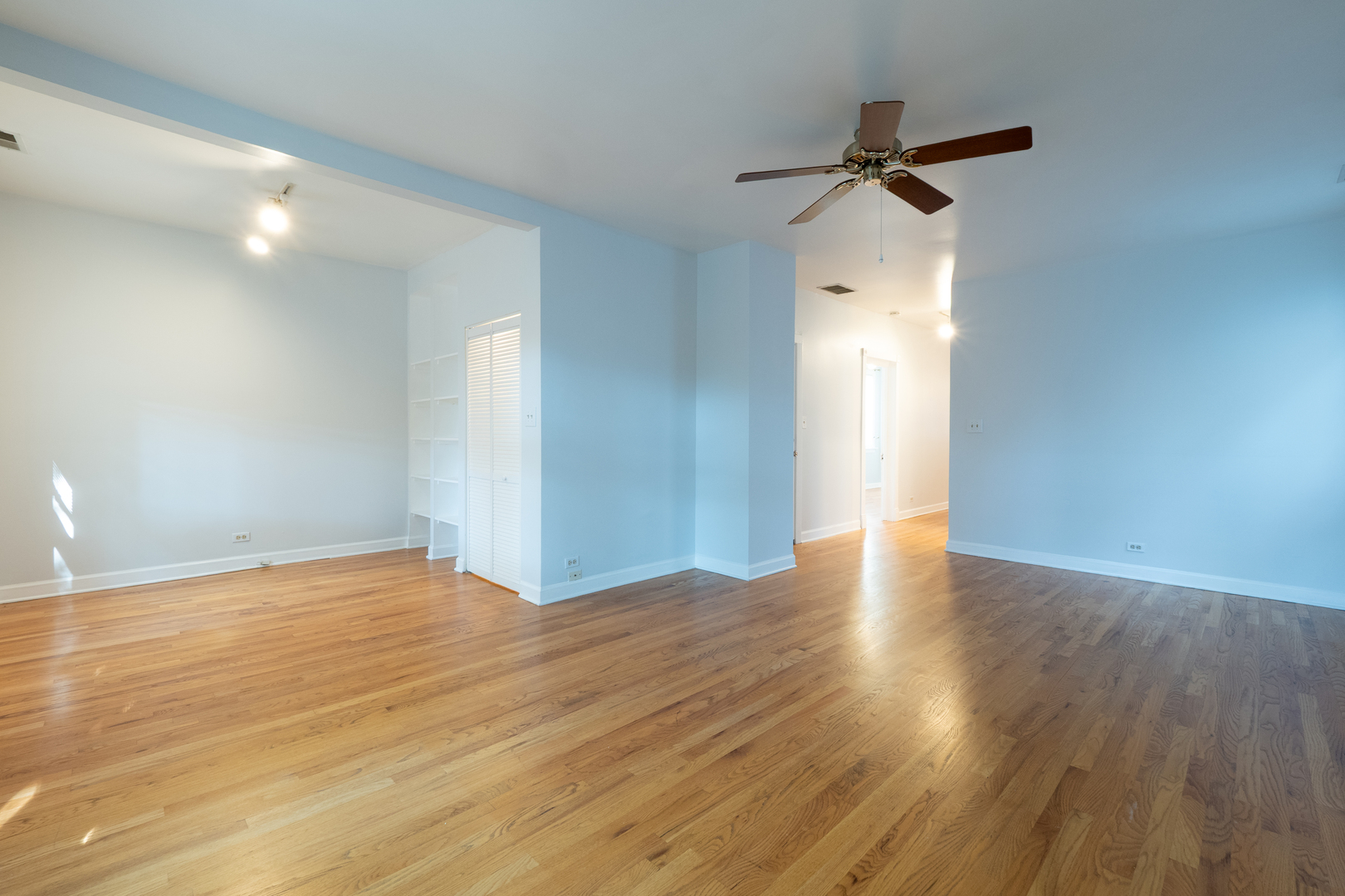 1920 West School Street Chicago, IL 60657 - Photo 20 of 36 a view of a room with wooden floor and white walls