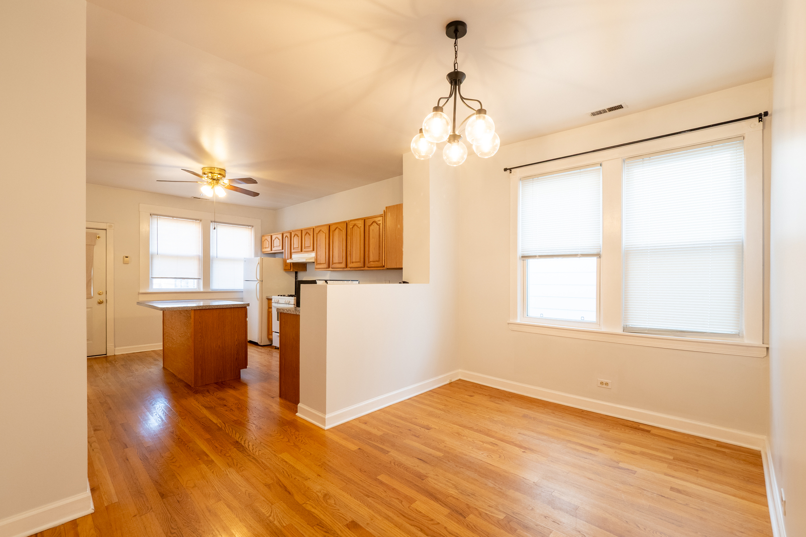 1920 West School Street Chicago, IL 60657 - Photo 26 of 36 wooden floor in an empty room with a window