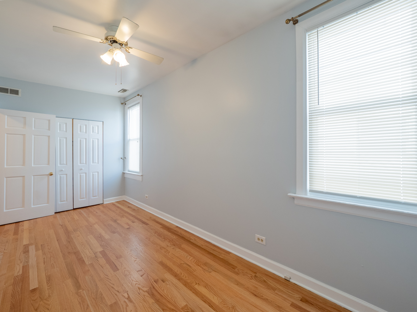 1920 West School Street Chicago, IL 60657 - Photo 31 of 36 wooden floor in an empty room with a window