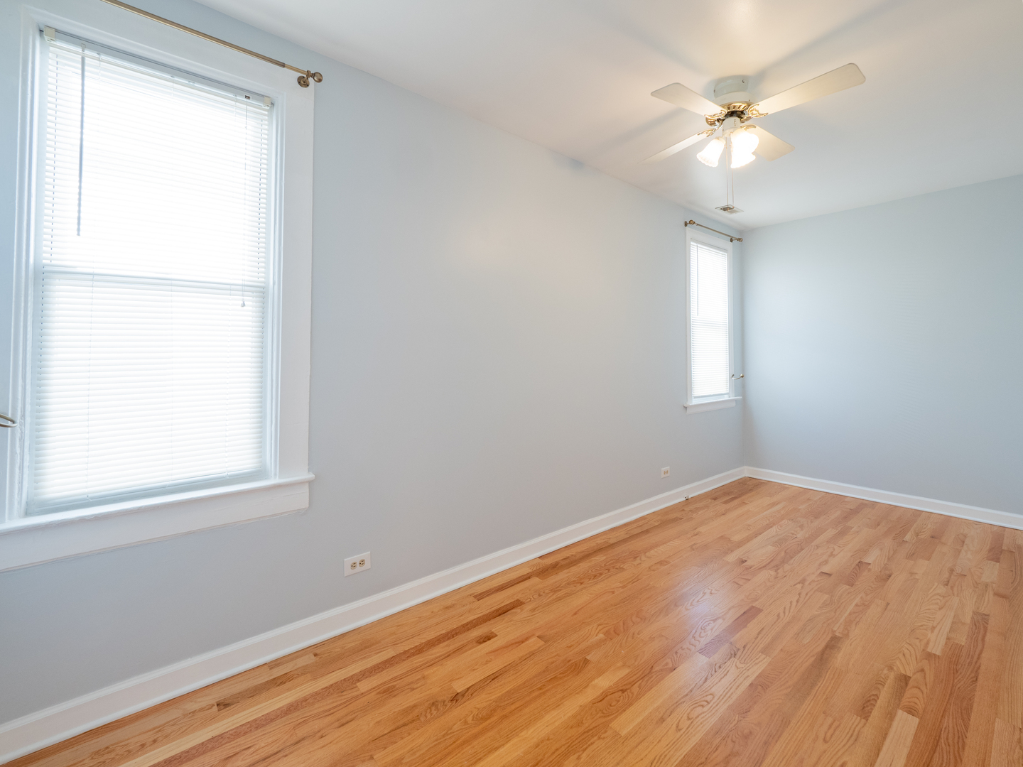 1920 West School Street Chicago, IL 60657 - Photo 32 of 36 wooden floor in an empty room with a window