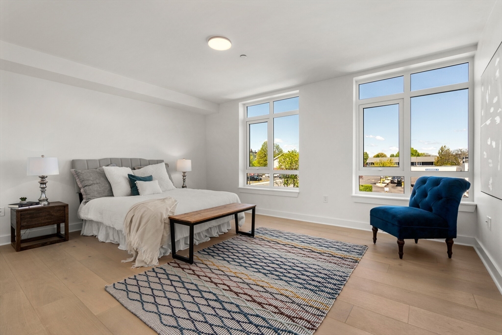 917 Bennington Street, Unit 301 Boston, MA 02128 - Photo 6 of 17 a bedroom with a bed and a window