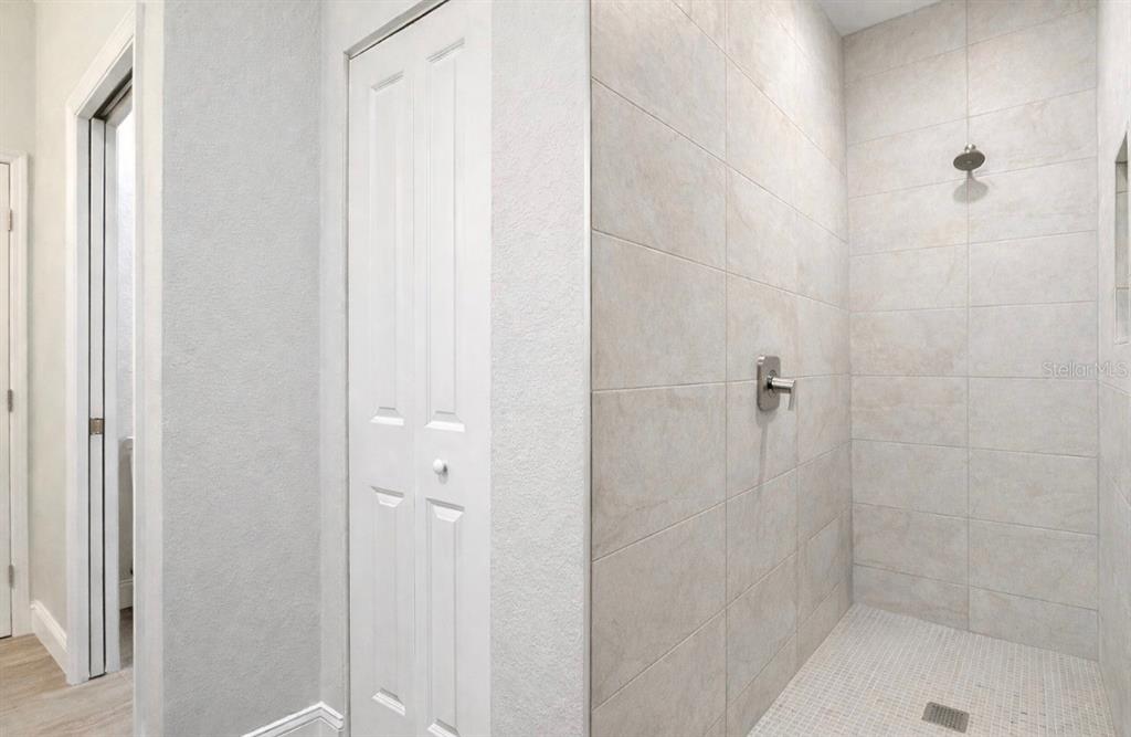6231 Rowe Street Englewood, FL 34224 - Photo 13 of 14 a bathroom with a shower