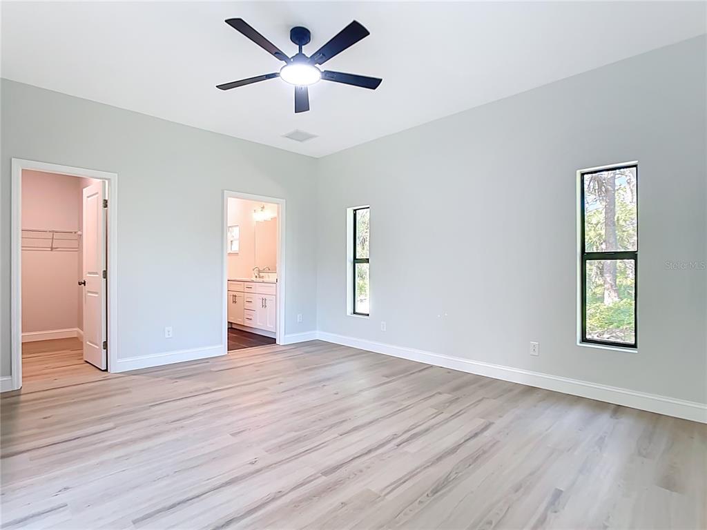 6231 Rowe Street Englewood, FL 34224 - Photo 14 of 35 wooden floor in an empty room with a window
