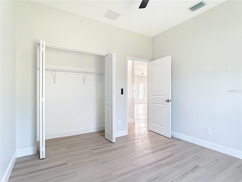 6231 Rowe Street Englewood, FL 34224 - Photo 23 of 35 a view of an empty room with wooden floor