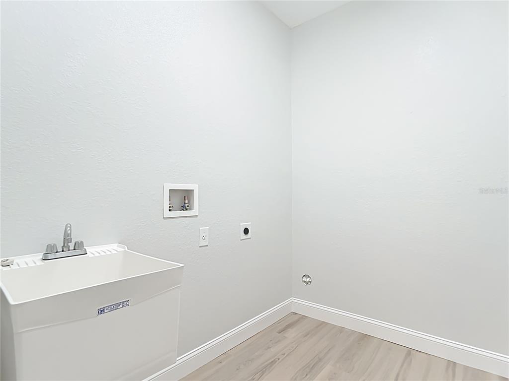 6231 Rowe Street Englewood, FL 34224 - Photo 28 of 35 a bathroom with a sink and a mirror