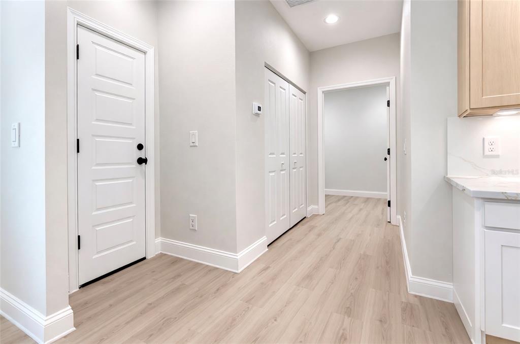 6231 Rowe Street Englewood, FL 34224 - Photo 9 of 14 a view of a hallway with wooden floor