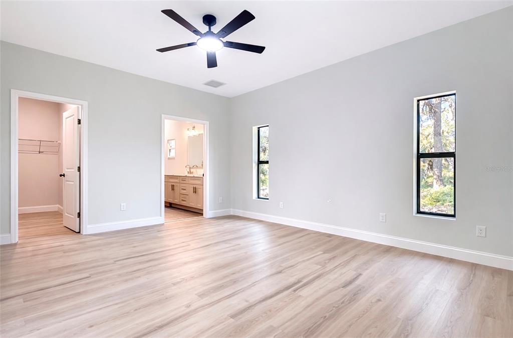 6231 Rowe Street Englewood, FL 34224 - Photo 10 of 14 a view of an empty room with wooden floor and a window