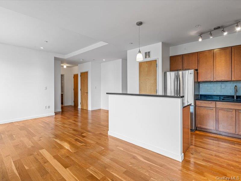 14 Hope Street, Unit 3F Brooklyn, NY 11211 - Photo 5 of 18 a view of a kitchen with a refrigerator and a stove top oven