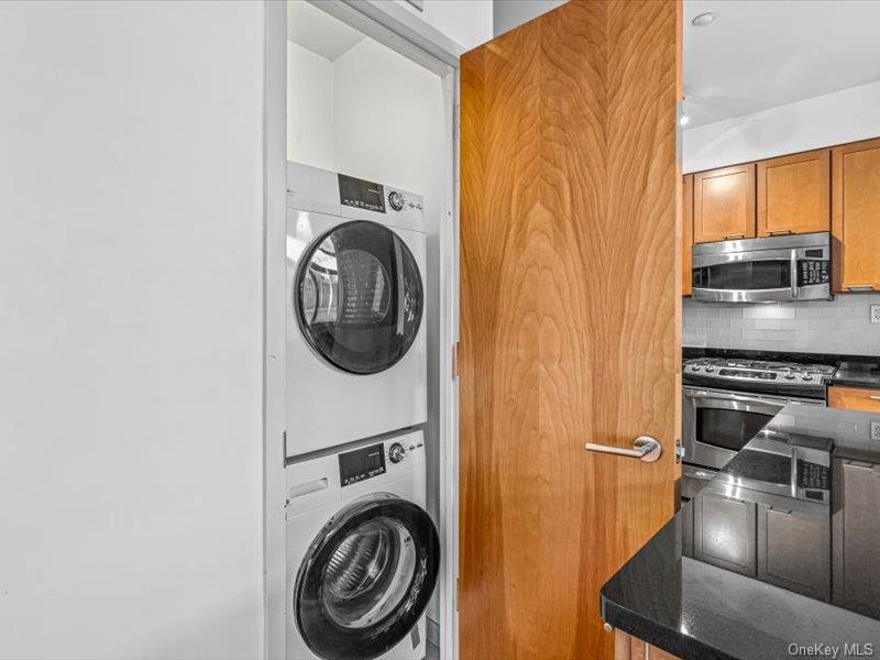 14 Hope Street, Unit 3F Brooklyn, NY 11211 - Photo 9 of 18 a view of a kitchen with stainless steel appliances granite countertop a refrigerator and a stove top oven