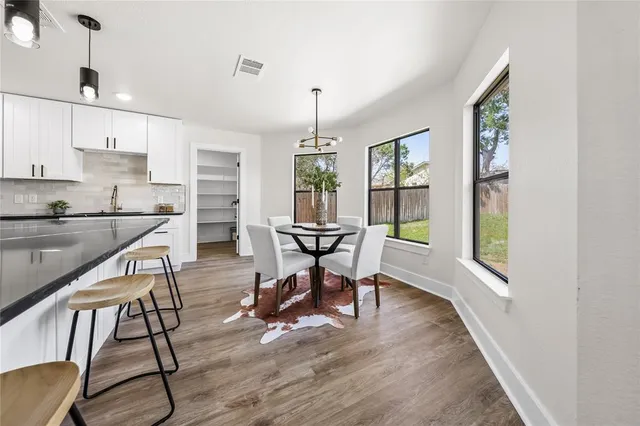 a view of a bathroom with a sink and mirror