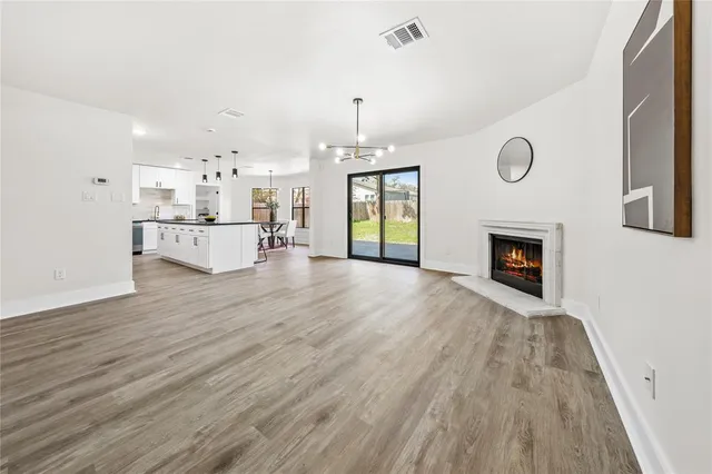 a bathroom with a double vanity sink a toilet a bathtub and shower