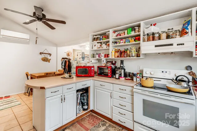 a kitchen with a refrigerator and cabinets