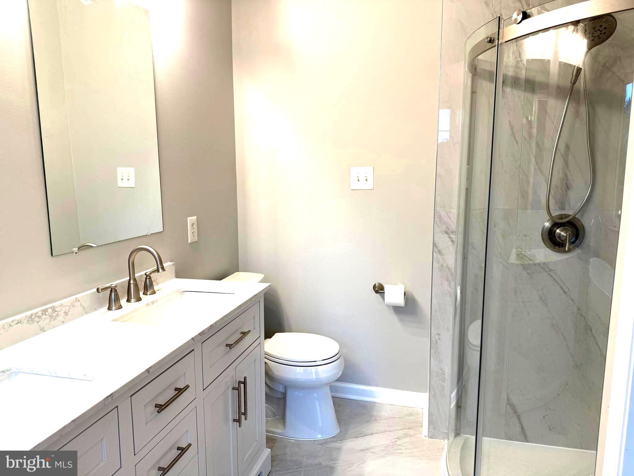 5992 Autumn Spell Elkridge, MD 21075 - Photo 14 of 30 a bathroom with a sink a toilet and shower