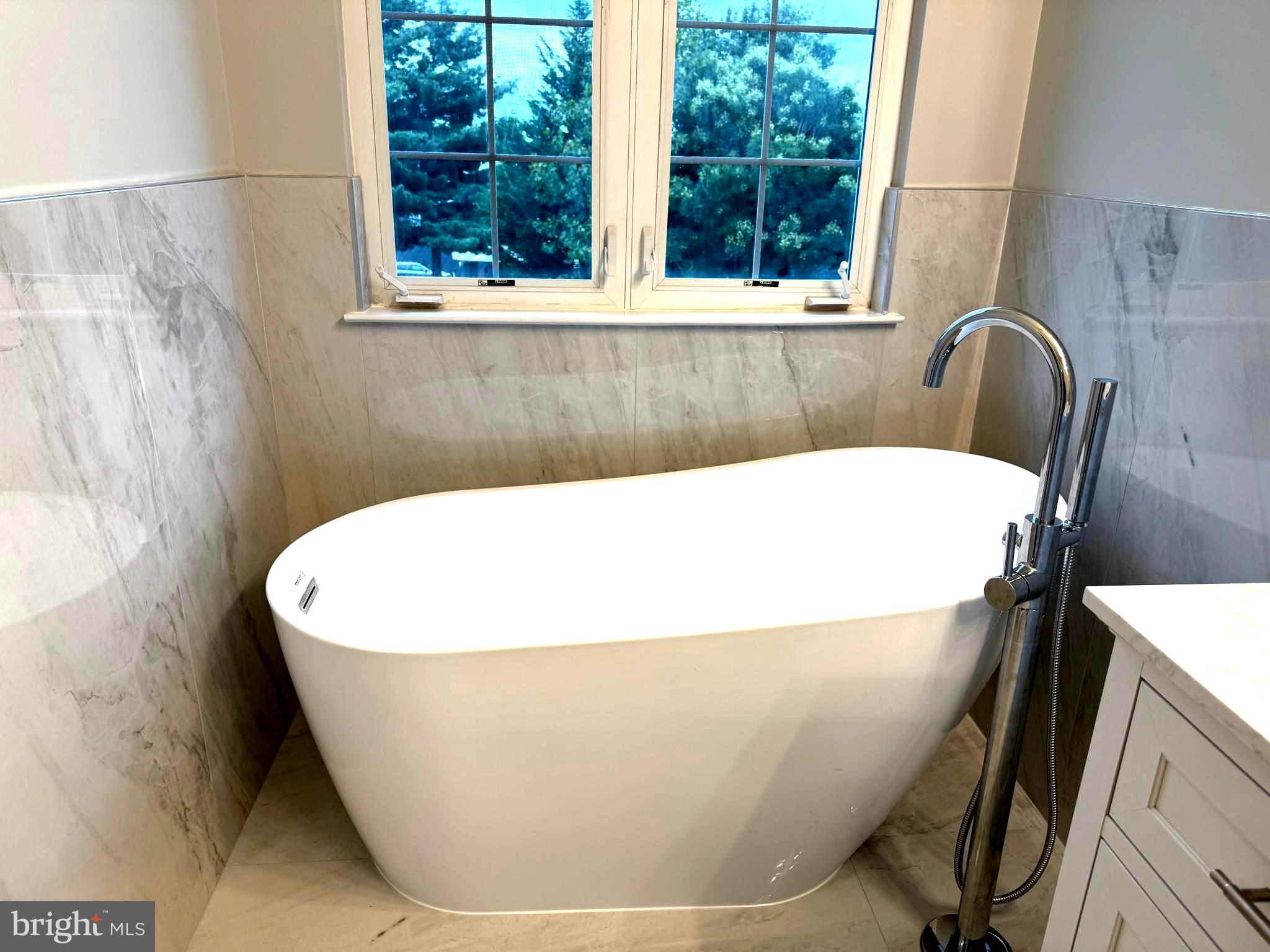 5992 Autumn Spell Elkridge, MD 21075 - Photo 16 of 30 a white bath tub sitting in a bathroom