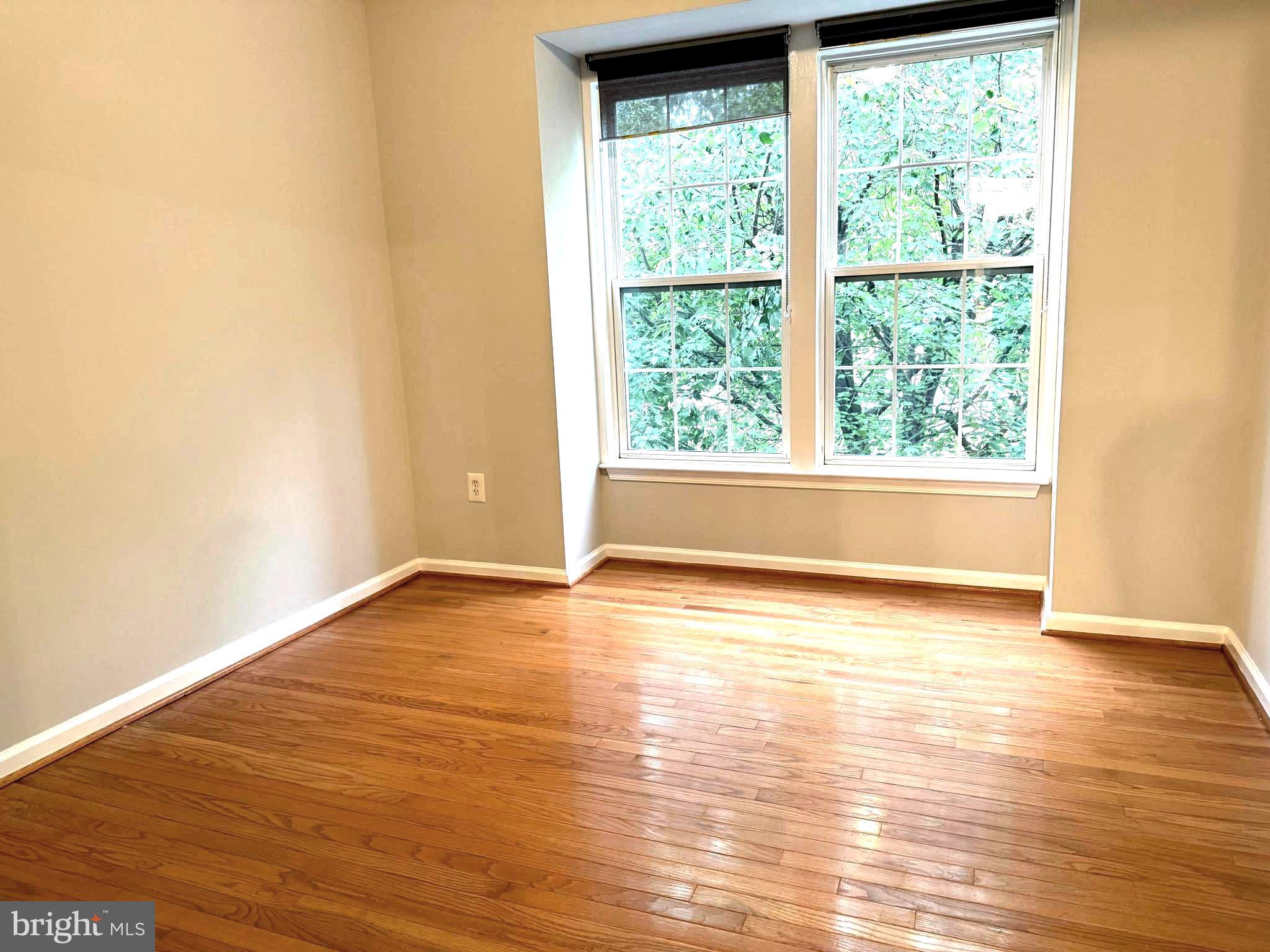 5992 Autumn Spell Elkridge, MD 21075 - Photo 19 of 30 a view of empty room with wooden floor and fan
