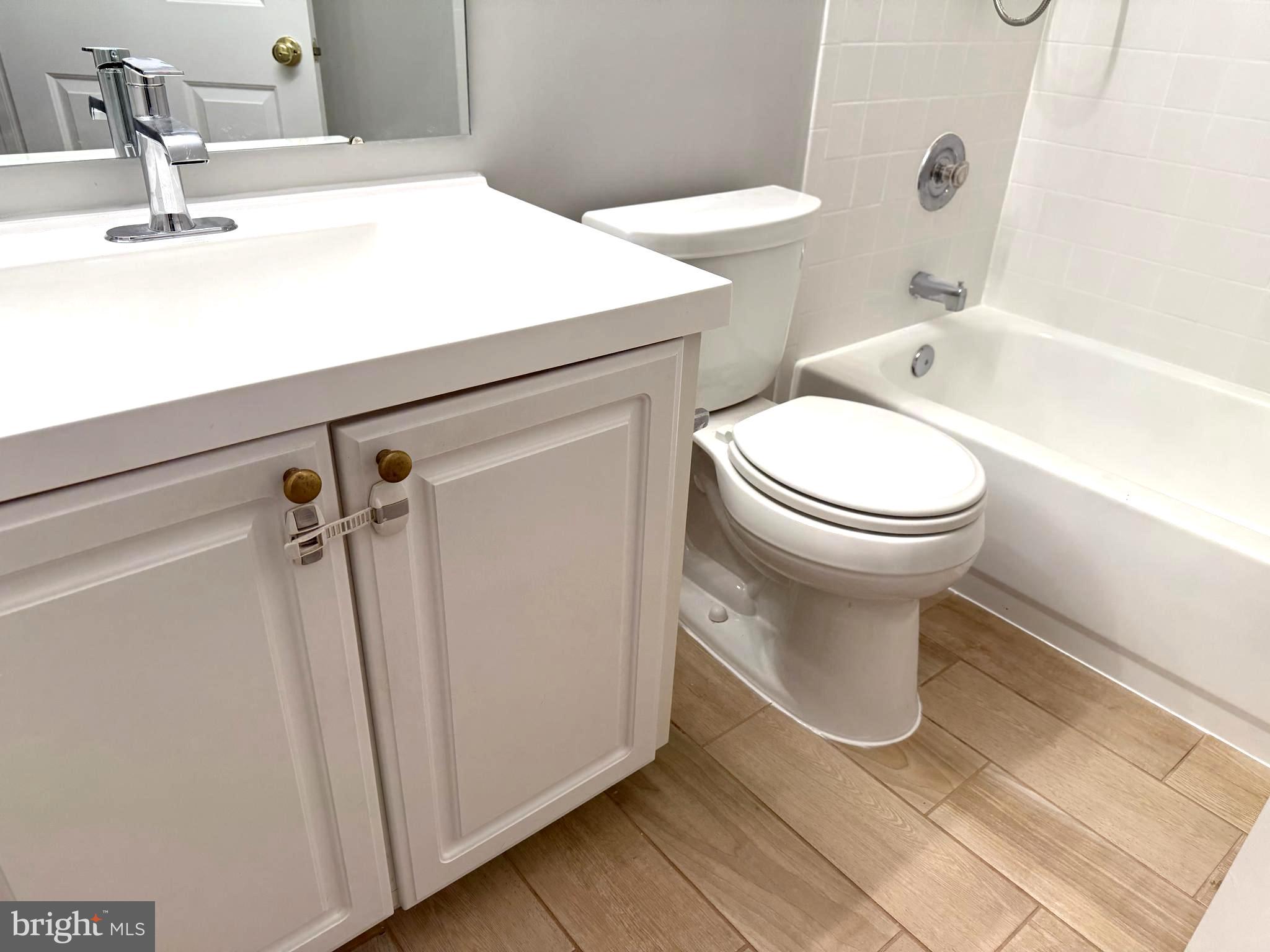 5992 Autumn Spell Elkridge, MD 21075 - Photo 21 of 30 a bathroom with a sink a toilet a mirror and shower