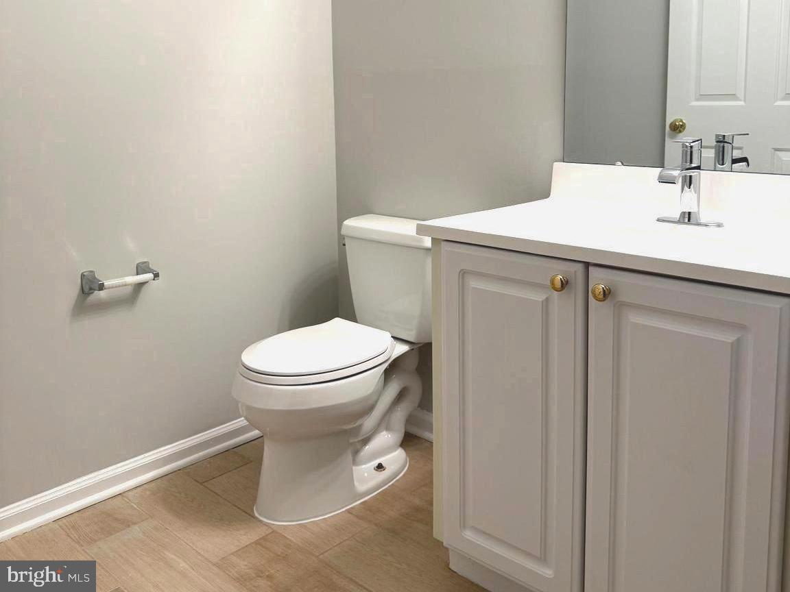 5992 Autumn Spell Elkridge, MD 21075 - Photo 25 of 30 a bathroom with a toilet sink and vanity