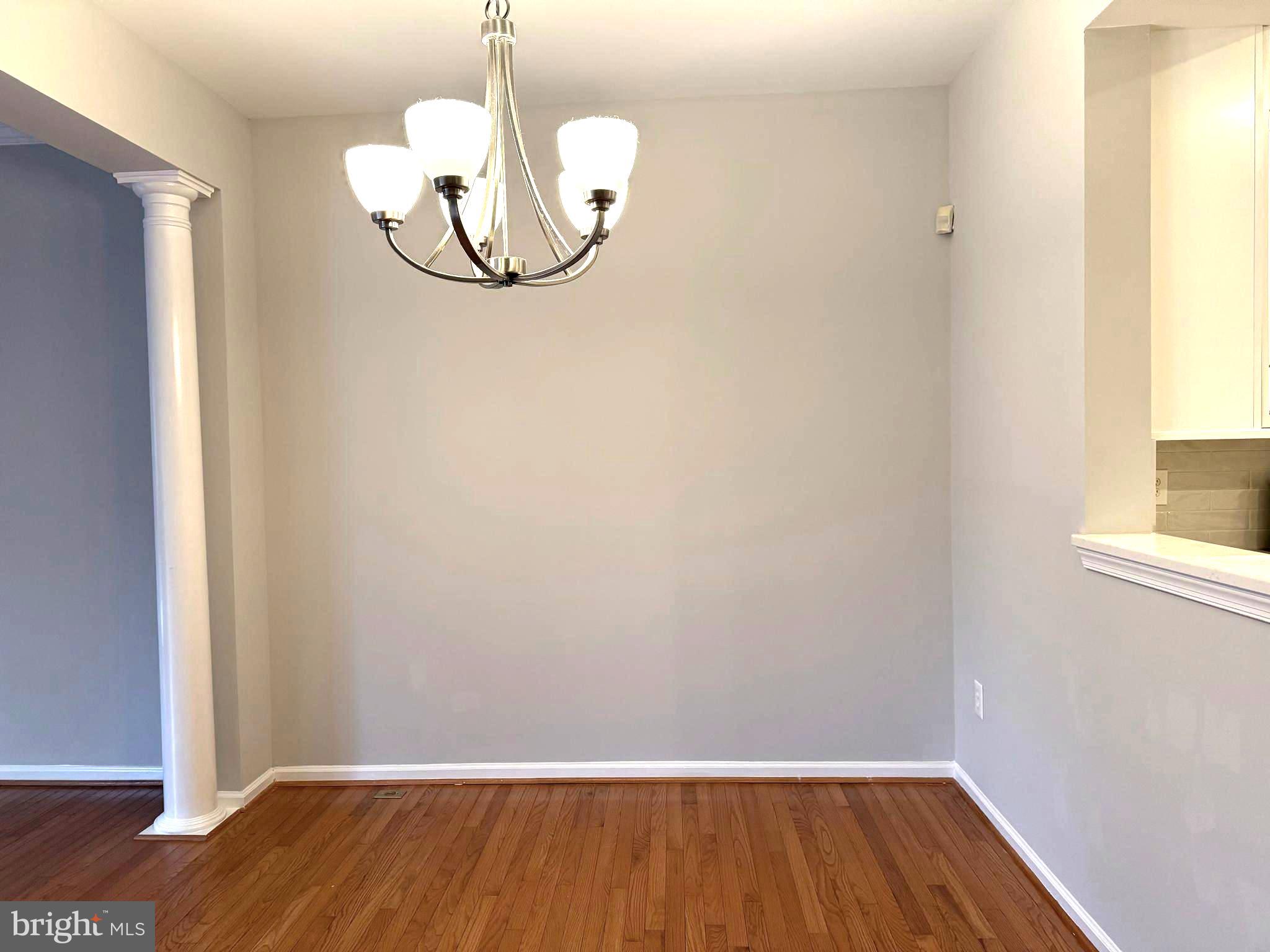 5992 Autumn Spell Elkridge, MD 21075 - Photo 6 of 30 a view of a room with wooden floor and a window